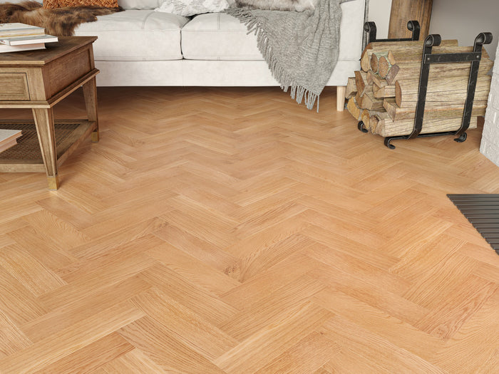 Wooden floor with a herringbone pattern in a living room setting.